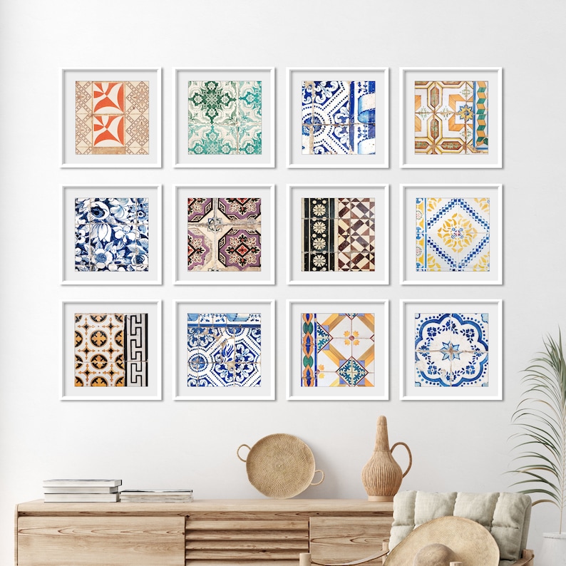 May include: Nine framed prints of colorful patterned tiles, arranged in a grid on a white wall. The tiles feature geometric designs in shades of blue, yellow, green, red, and white.
