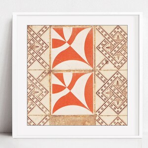 May include: A close-up of two orange and white patterned tiles with a geometric design. The tiles are framed in a white frame.