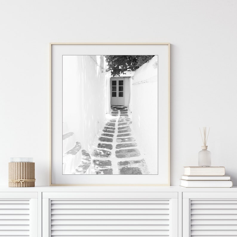 Greece photograph of a small cobblestone street and doorway. Black and white photography print.