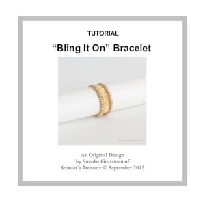 May include: A gold and white beaded bracelet with the text "Bling It On" Bracelet. The bracelet is an original design by Smadar Grossman of Smadar's Treasure, September 2015.