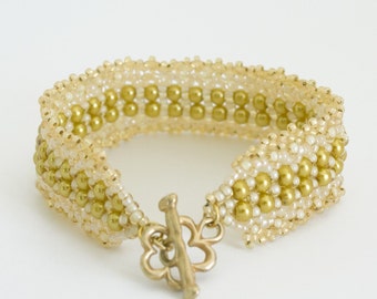 Beaded Bracelet with Gold Glass Pearls and Cream Beads with Semi Matte Gold Plated Flower Shaped Clasp. S112
