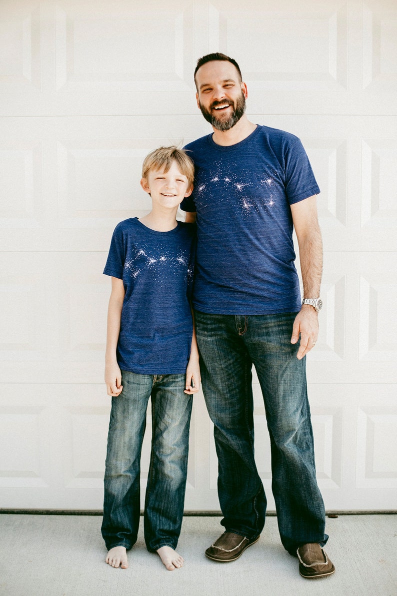 Big and Little Dipper matching Father Son t-shirt set in indigo blue. Adult shirt has the Big Dipper constellation printed across the chest. The child t-shirt has the Little Dipper print.