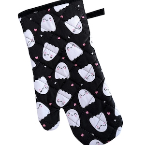 May include: Black oven mitt with a white quilted pattern of cute ghosts with pink hearts.