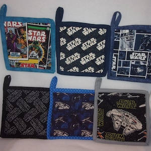 May include: Six Star Wars themed pot holders.  The pot holders are square and have different designs.  One pot holder has a comic book design with the words "Star Wars" on it.  Another pot holder has a black background with the words "Star Wars" repeated in white.  Another pot holder has a blue background with the words "Star Wars" repeated in white.  Another pot holder has a blue background with a design of R2-D2 and Darth Vader.  Another pot holder has a black background with a design of a spaceship.  Another pot holder has a gray background with a design of a spaceship.