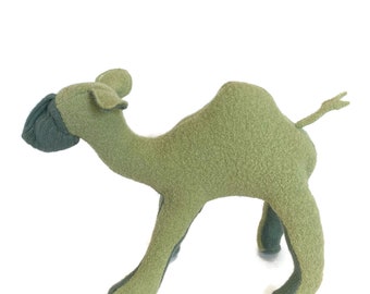 May include: A green plush camel toy with a long neck and a hump on its back. The camel has a dark green head and legs.