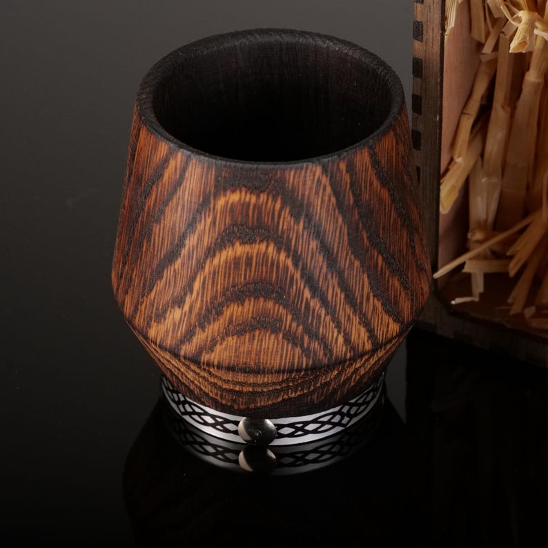 Comparison of an authentic charred oak tumbler interior and an imitation black painted interior, showing the difference in texture.