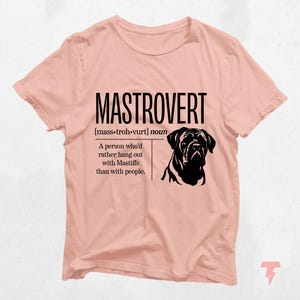 a pink t - shirt with a picture of a dog on it