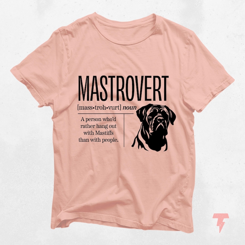 a pink t - shirt with a picture of a dog on it