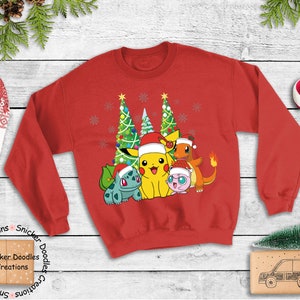 May include: Red Christmas sweater with a graphic of Pikachu, Bulbasaur, Charmander, and Jigglypuff standing in front of two Christmas trees. The Pokemon are wearing Santa hats. The sweater has the words 'Snicker Doodles Creations' printed on the bottom left and bottom right.