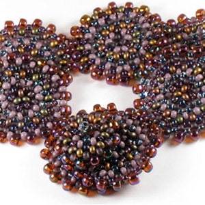 May include: A beaded bracelet with three round, multi-colored, iridescent, beaded sections.