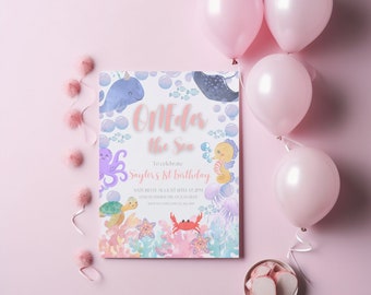 May include: A pink and blue invitation card with the text "Oneda the Sea" and "Saylor's 1st birthday". The card features a watercolor illustration of sea creatures, including a whale, octopus, seahorse, turtle, crab, and starfish.