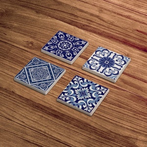 May include: Four blue and white ceramic coasters with intricate geometric patterns. The coasters are square and have a slightly raised edge.