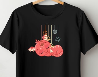 May include: A black t-shirt with a red cartoon dragon sleeping with dice hanging above it.