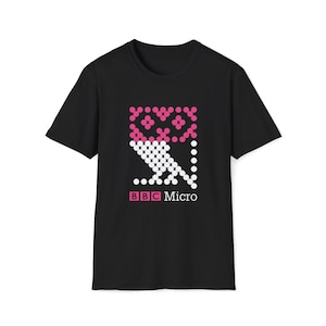 May include: Black t-shirt with a pink and white pixelated owl design and the text "BBC Micro" below it.