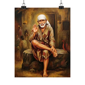 May include: A print of a spiritual figure, seated on a stone, with a white turban and beard, raising a hand in blessing. The artwork features warm, earthy tones and is attached to a wall with black clips.