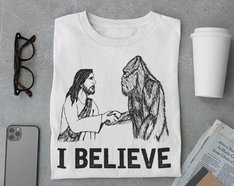 Jesus Bigfoot I BELIEVE poignée de main t-shirt Sasquatch Cadeau drôle Christian tee vintage yeti mens cool tshirt ORIGINAL ART chemises dessinées à la main