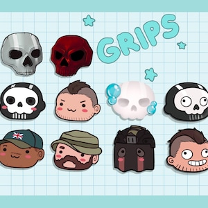 May include: A set of 10 cartoon character pins featuring skulls, a man with a beard, and a man with a moustache. The pins are on a blue and white grid background with the word "GRIPS" in a blue bubble.