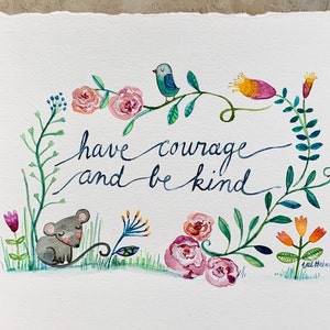 May include: Watercolor painting of a floral wreath with a blue bird, a gray mouse, and the text "have courage and be kind".