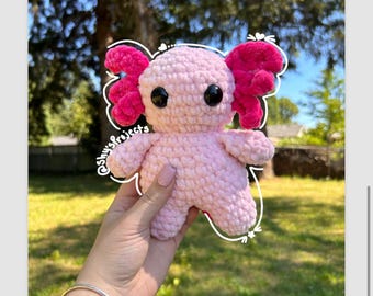 Peluche Axolotl de ganchillo hecho a mano con material suave y difuso.