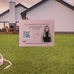May include: A pink real estate sign with a QR code, a woman's headshot, and the text "Your Neighborhood Realtor Jennifer Demchuk 206.280.9999 JD exp Ready to buy or sell? Contact me today!"