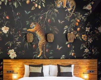 May include: A bedroom featuring a bed with a white comforter, two dark gray pillows, and a horizontal wood-slat headboard. The wall behind the bed is covered in black wallpaper with a pattern of tigers, monkeys, butterflies, and fruit.