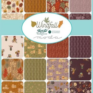 May include: A fabric swatch collection featuring sixteen squares with autumn-themed patterns including pumpkins, fall leaves, and floral arrangements in shades of orange, brown, green, and purple. The center label reads Windfall Fancy That by Stephanie Sliwinski moda.