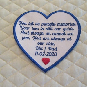May include: Heart-shaped patch with a blue border and white center. The patch features embroidered text: "You left us peaceful memories. Your love is still our guide..." and "Bill | Dad 11-02-2020." A small red heart is at the bottom.