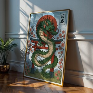 May include: A framed art print featuring a green dragon with red accents, a red sun, and Japanese text. The dragon is coiled around a red torii gate, with cherry blossoms in the background. The frame is gold.