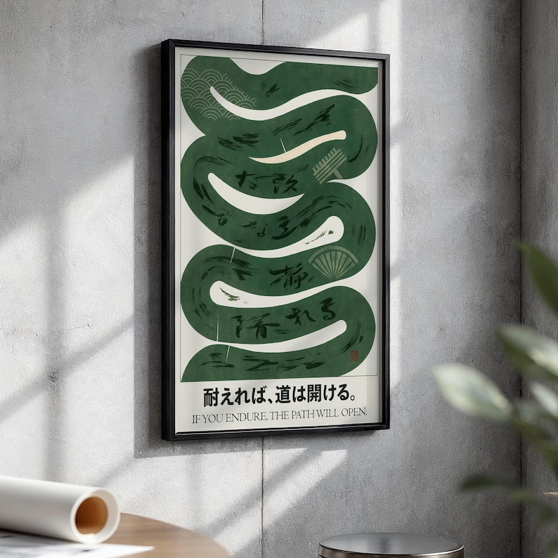 May include: A framed art print featuring a green, stylized snake-like design on a cream background. Japanese text and the English translation "IF YOU ENDURE, THE PATH WILL OPEN" are at the bottom. The artwork is in a black frame.