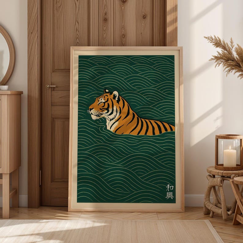 May include: A framed art print featuring a tiger swimming in water. The tiger has orange and black stripes, set against a dark green background with white wave patterns. The print has a wooden frame and Japanese text in the lower right corner.