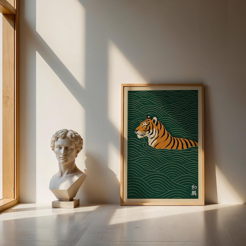 May include: A framed art print featuring a tiger swimming in stylized green water. The tiger is orange and black, with a detailed illustration. The print has a wooden frame and is displayed near a classical bust.