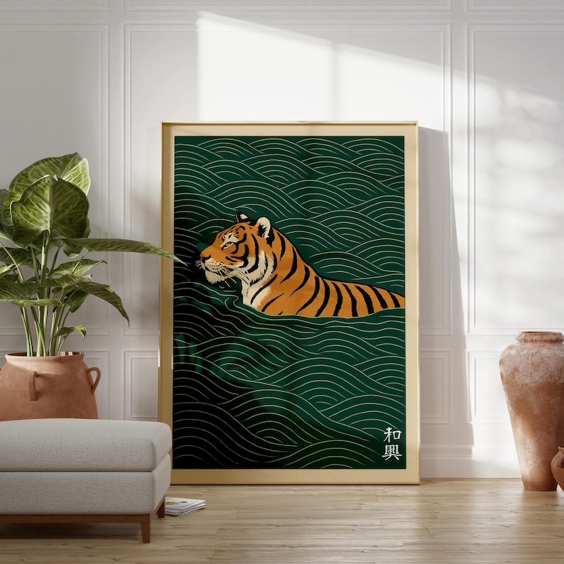 May include: A framed art print featuring a tiger swimming in water. The tiger has orange and black stripes, set against a dark green background with a wave pattern. The frame is gold.