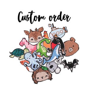 May include: A collection of colourful embroidered iron-on patches featuring various animals, including a deer, a dinosaur, a turtle, an octopus, a whale, a bear, a bat, a koala, a hedgehog, a giraffe, a chicken, a submarine, and a bird. The patches are arranged in a cluster and the text "Custom order" is written above them.