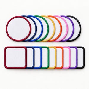 May include: A collection of circular and square fabric patches with white centers and colored borders in red, dark blue, blue, green, yellow, orange, pink, purple, and black. These patches feature stitched edges and a flat, smooth surface.