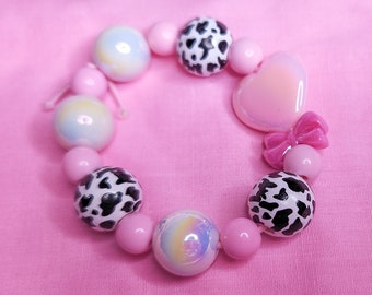 Pink iridescent bow heart cow cottagecore coquette lovecore kandi stretch bracelet