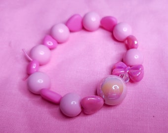 Pink fuchsia iridescent heart bow lovecore kandi stretch bracelet