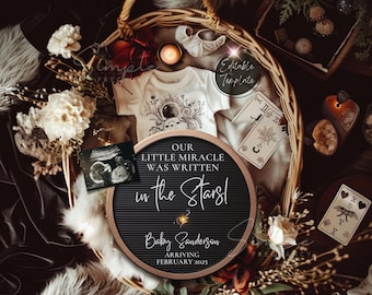 May include: A black letter board with the text "Our little miracle was written in the stars!" and "Baby Sanderson Arriving February 2025". The letter board is surrounded by a white onesie with a moon and stars design, a small ultrasound image, tarot cards, and other decorative items.