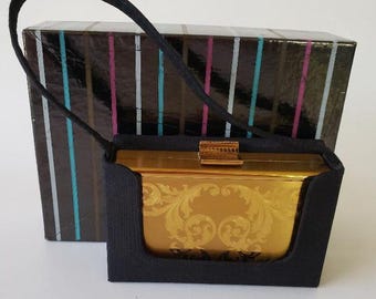 Bolso de mano compacto Elgin American de los años 50, de metal, con funda de transporte y caja de presentación original.