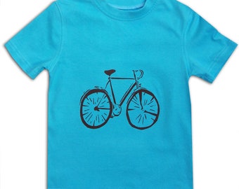 May include: A turquoise blue t-shirt with a black silhouette of a bicycle printed on the front.