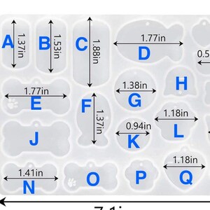 May include: A translucent silicone mold sheet featuring eighteen distinct shapes for crafting tags, labeled A through R. The sheet includes various bone, paw, and geometric outlines with printed dimensions in inches, such as 1.77in and 1.37in.