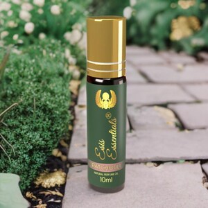 May include: A gold and green roll-on bottle with a gold cap. The label reads "Esis Essentials" and "Patchouli Natural Perfume Oil 10ml".