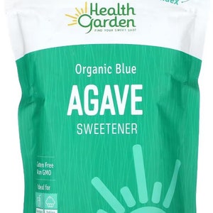 May include: A green and white bag of Health Garden Organic Blue Agave Sweetener. The bag is resealable and has a low glycemic index. It is gluten free, non-GMO, and USDA organic. The bag contains 12 ounces (341g) of agave.