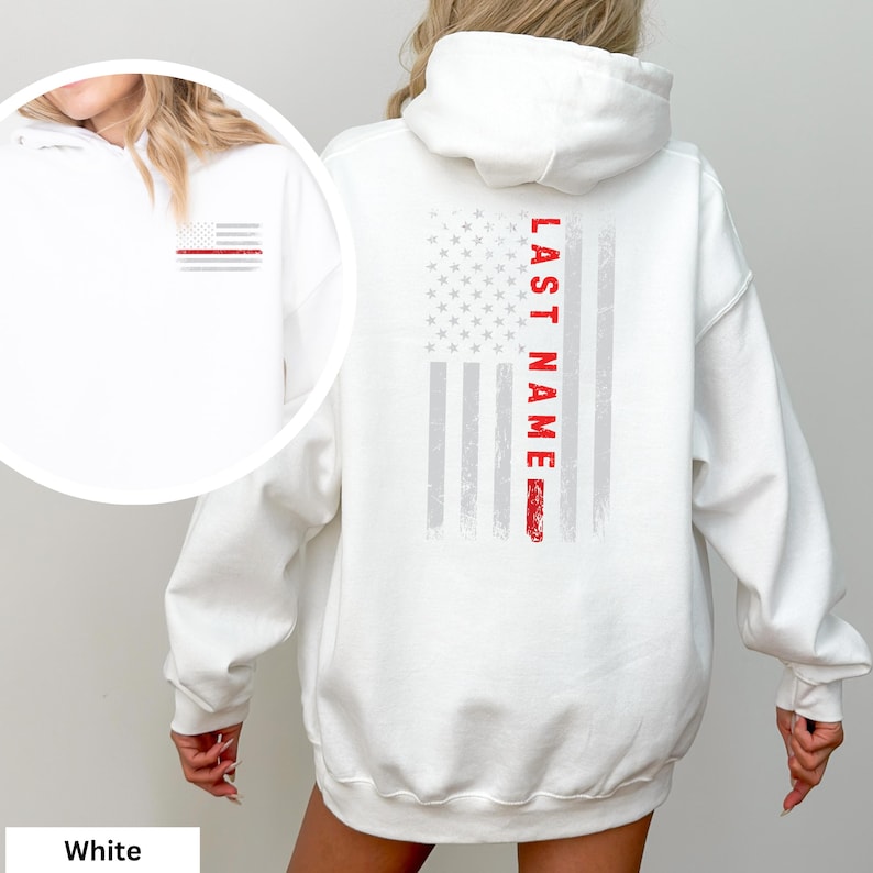 a woman wearing a white hoodie with an american flag on it