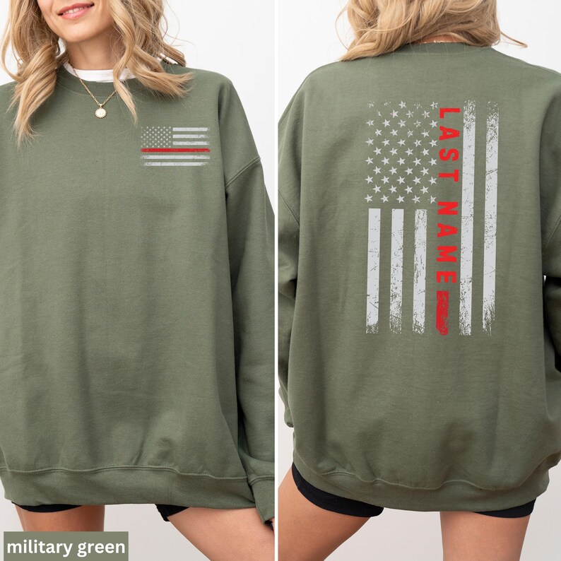 a woman wearing a green sweatshirt with an american flag on it