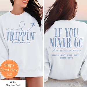 May include: White sweatshirt with blue text that says "We Be TRIPPIN'" with a dotted line and airplane graphic. The text "CANCUN, MEXICO 2026" is below. The back of the sweatshirt says "IF YOU NEVER GO You'll never know" with names.