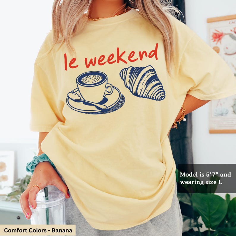 a woman wearing a t - shirt that says i weekend with a cup of coffee