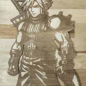May include: A laser-cut wooden wall art piece depicting a stylized anime character with spiky hair, wearing armor and carrying a large sword on their back. The design features intricate cutouts and engraved details on a light brown wood surface.