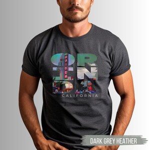 Dark Grey Heather shirt featuring Orinda California text with the iconic Orinda Theatre design integrated into the letters. Simple and stylish, this tee is perfect for showcasing local pride and celebrating Orinda and Lamorinda's charm