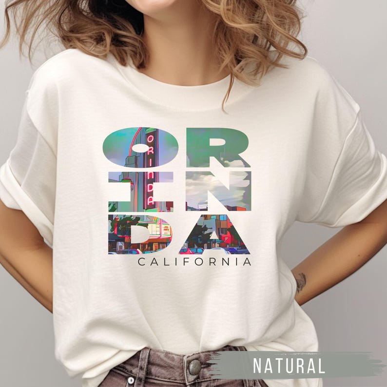 Natural shirt featuring Orinda California text with the iconic Orinda Theatre design integrated into the letters. Simple and stylish, this tee is perfect for showcasing local pride and celebrating Orinda and Lamorinda’s charm in the East Bay