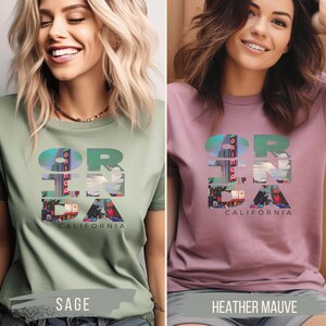Sage / Heather Mauve shirt featuring Orinda California text with the iconic Orinda Theatre design integrated into the letters. Simple and stylish, this tee is perfect for showcasing local pride and celebrating Orinda and Lamorinda’s charm